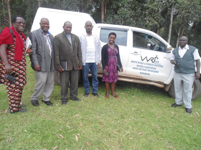 WATSAN staff standing next to the new vehicle