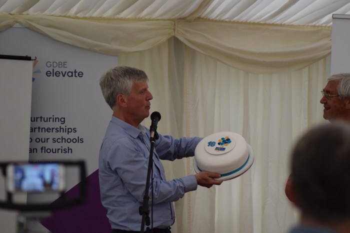 Bishop Andrew WATSAN with WATSAN's 18th birthday cake